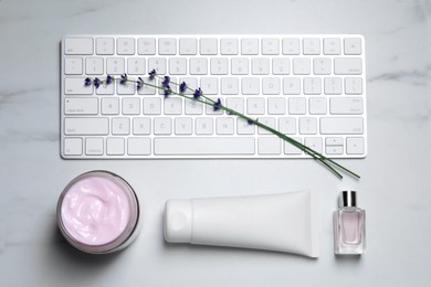 Flat lay composition with different hand care cosmetic products on white table