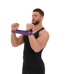 Young man exercising with elastic resistance band on white background