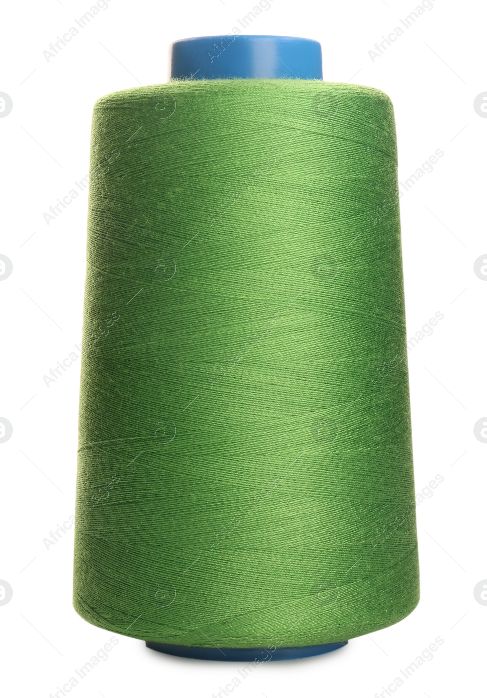 Photo of Spool of green sewing thread isolated on white