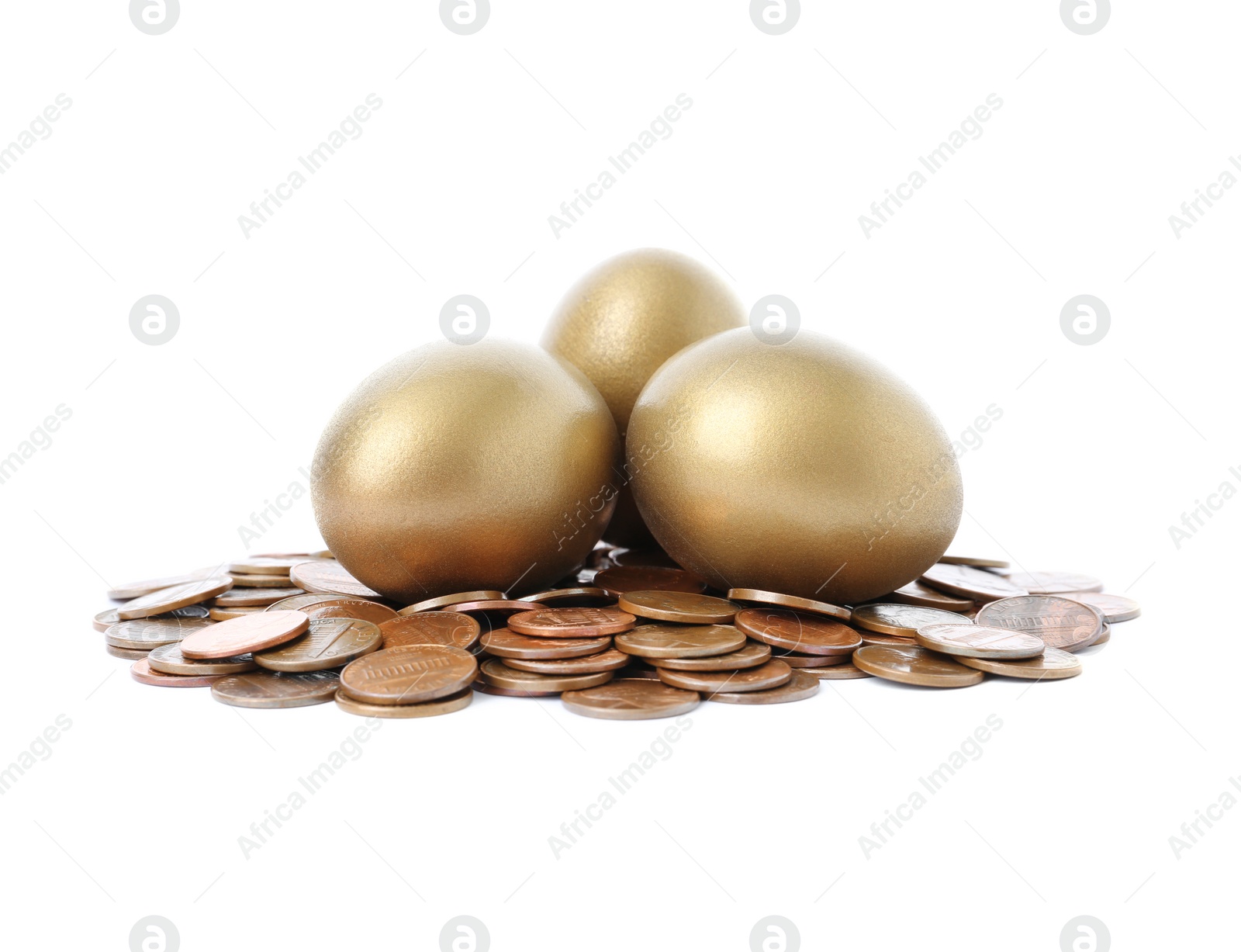 Photo of Gold eggs with coins on white background