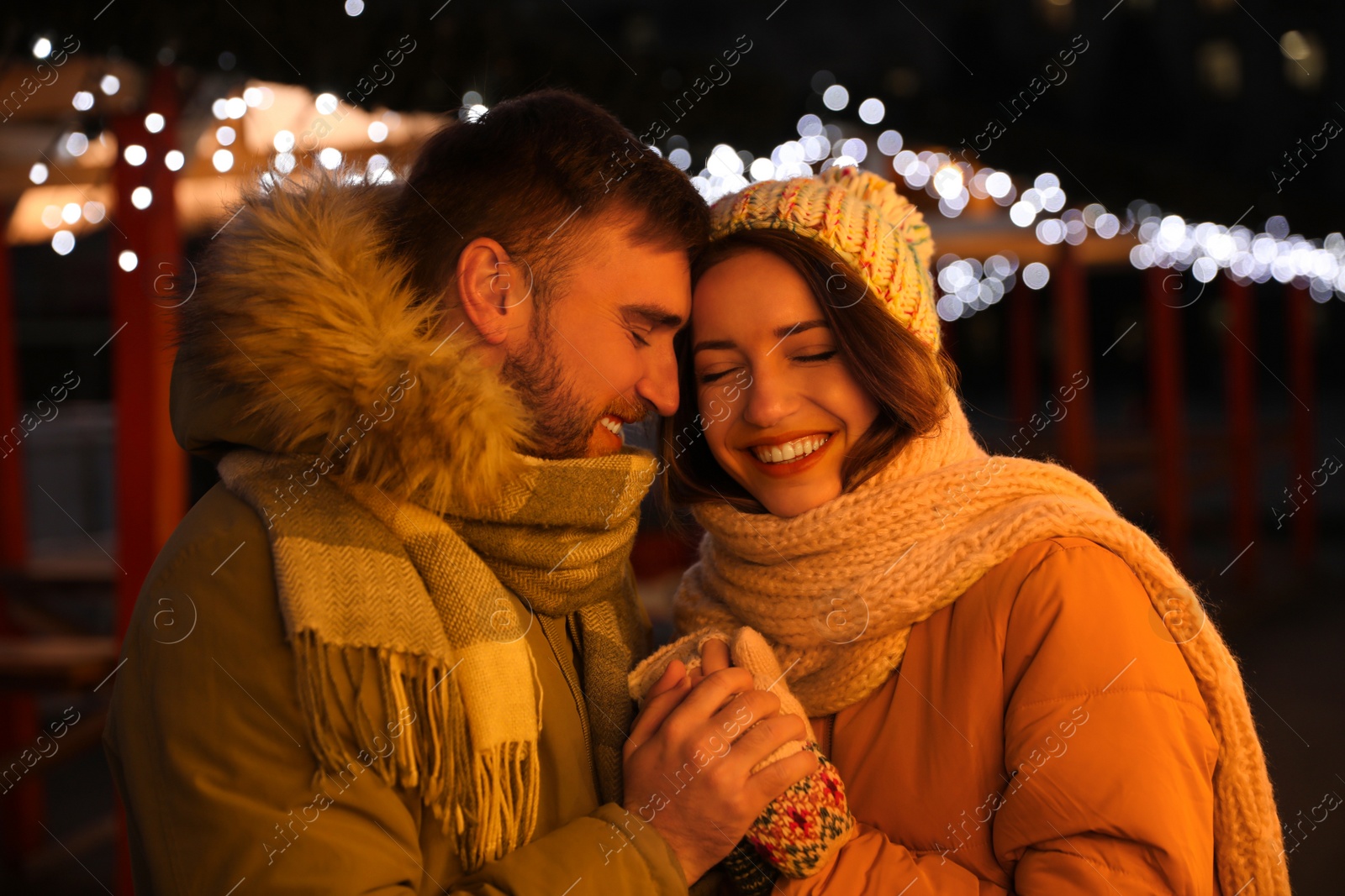 Photo of Happy couple spending time at Christmas fair