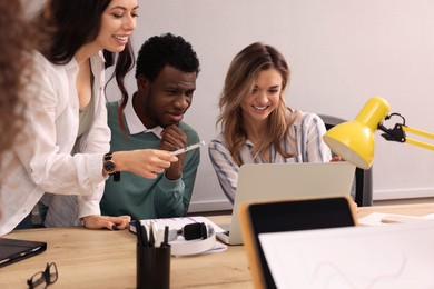 Photo of Team of employees working together in office. Startup project