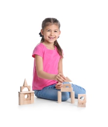 Photo of Cute child playing with wooden blocks on white background