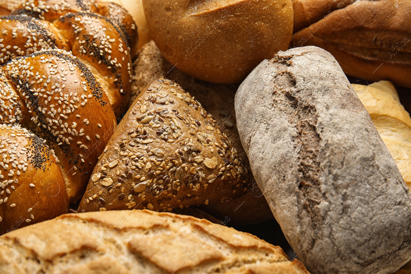 Photo of Fresh breads and pastry as background, closeup