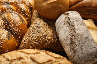 Photo of Fresh breads and pastry as background, closeup