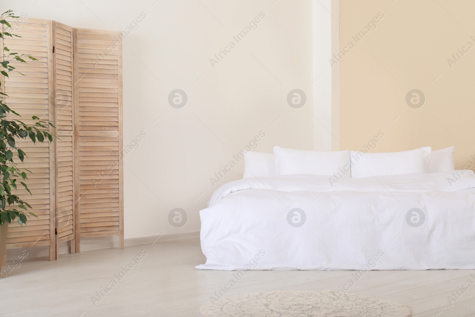 Photo of Stylish room interior with comfortable double bed