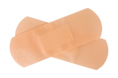 Photo of Medical adhesive bandages isolated on white, top view