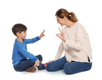 Hearing impaired mother and her child talking with help of sign language on white background