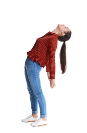 Young woman attracted to magnet on white background