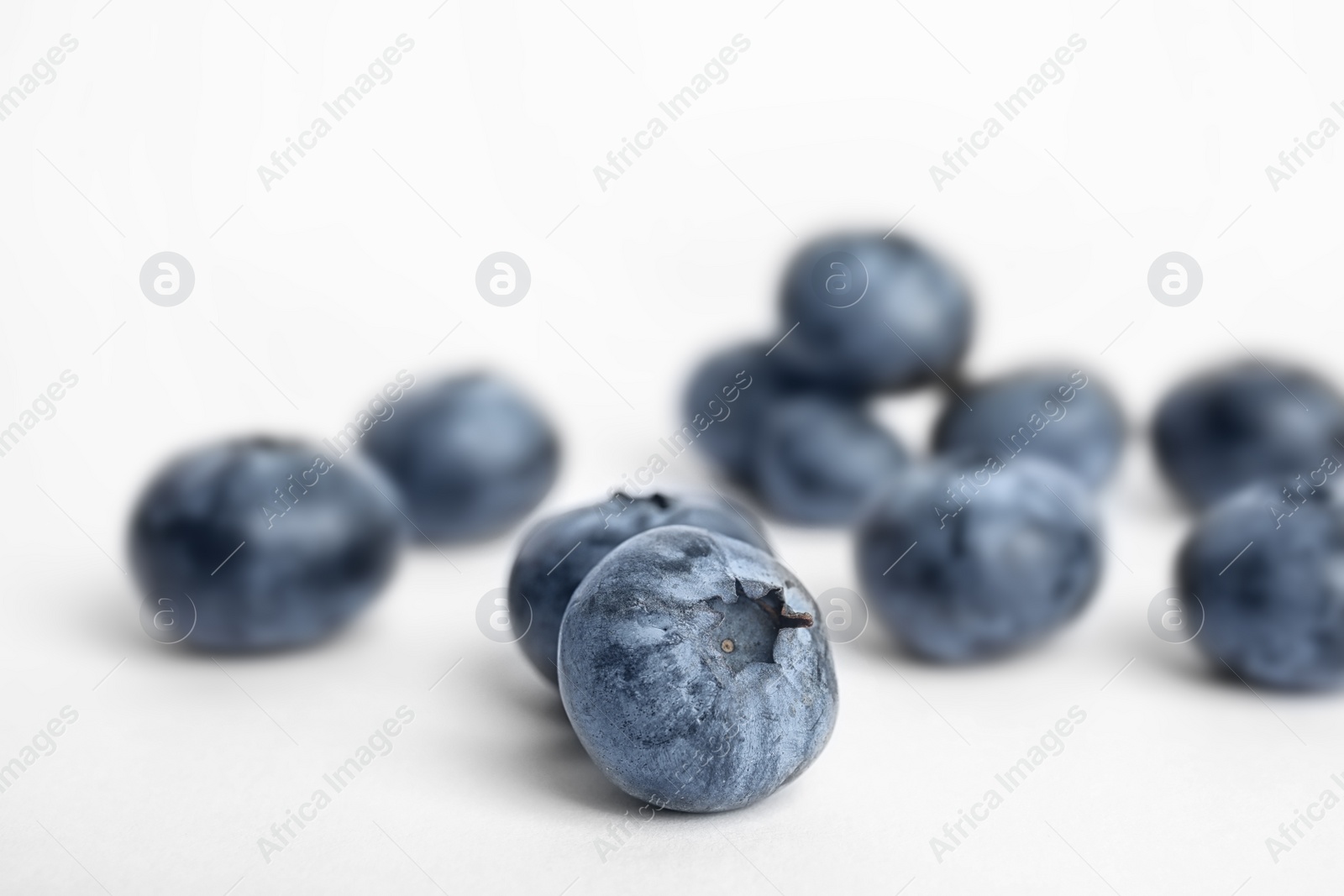 Photo of Tasty ripe blueberry on white background, closeup