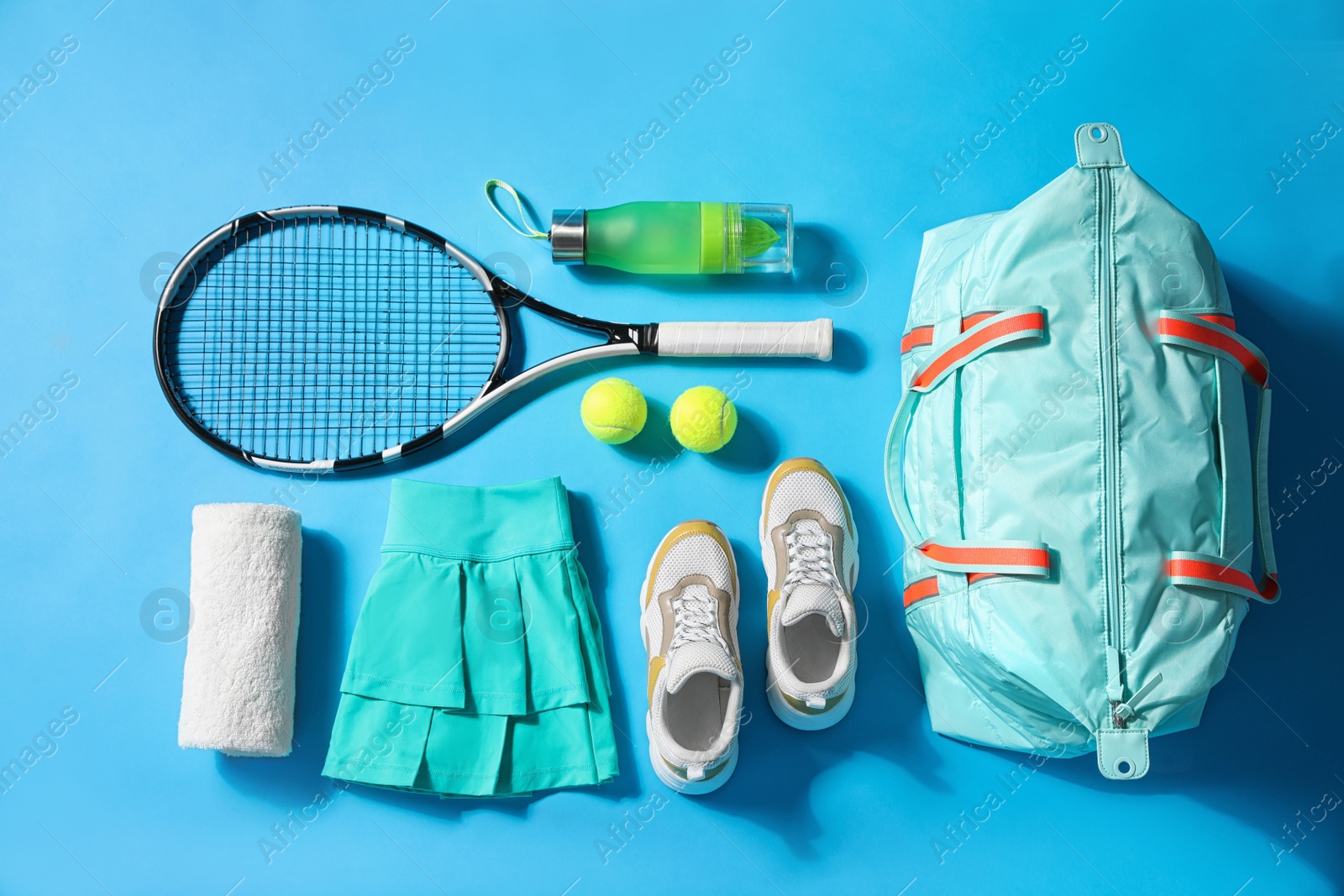 Photo of Flat lay composition with sports bag on light blue background