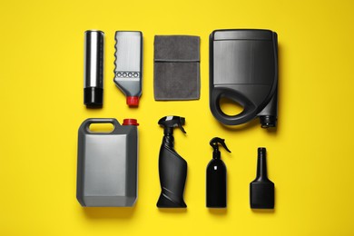 Different car products on yellow background, flat lay