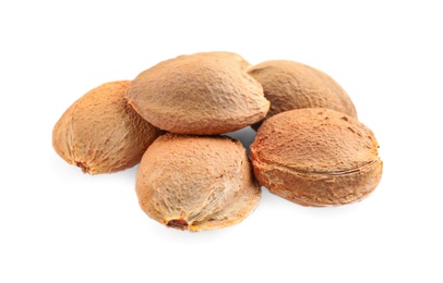 Photo of Organic dried apricot kernels on white background