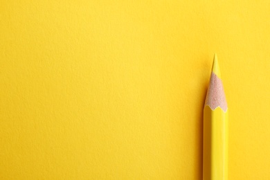 Photo of Color pencil on yellow background. Space for text