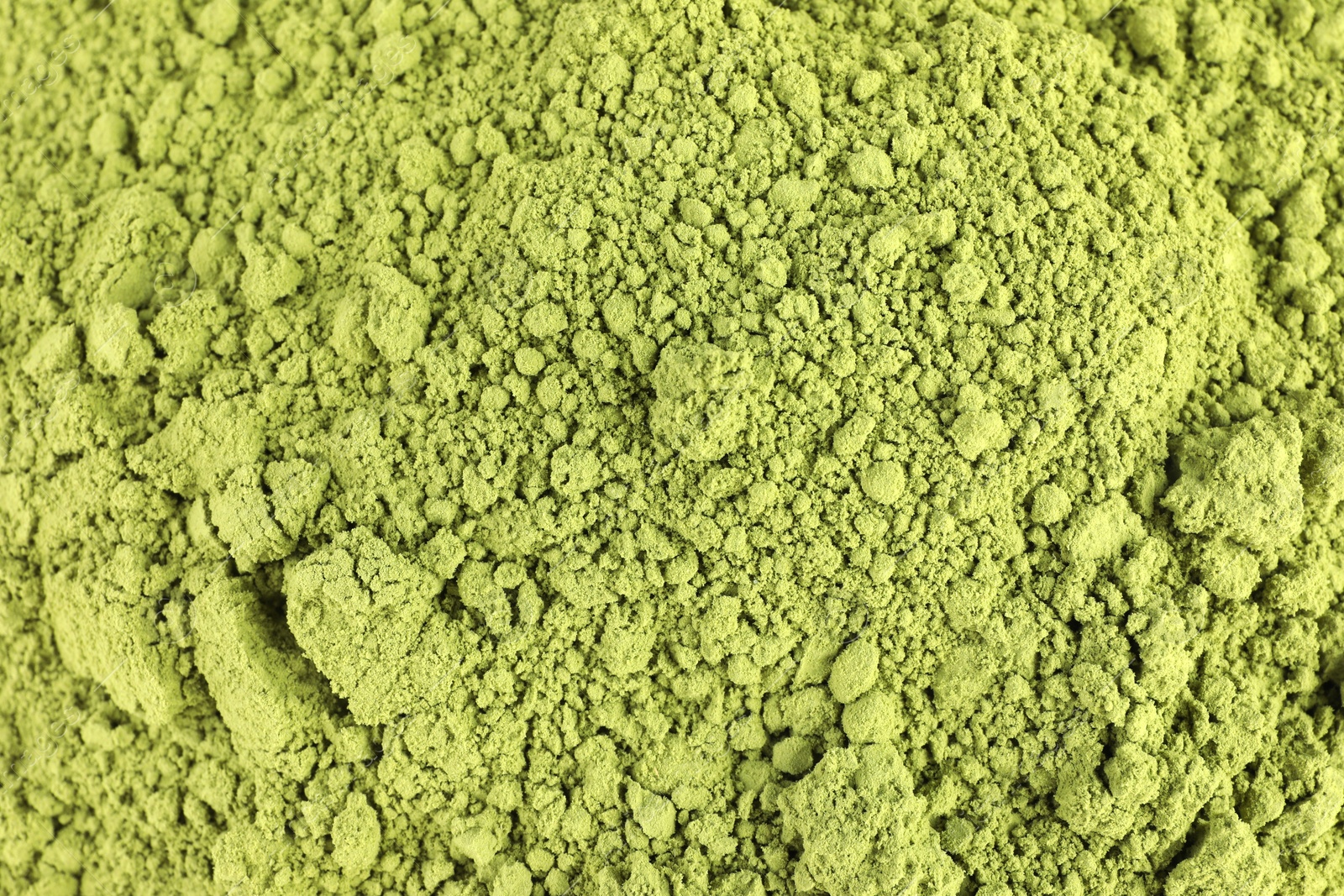 Photo of Green matcha powder as background, top view