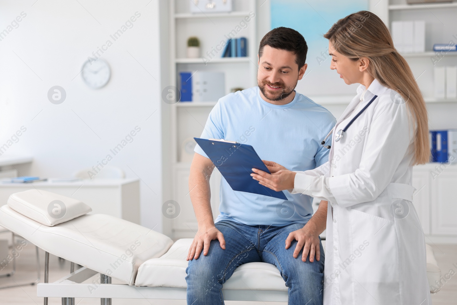 Photo of Professional doctor working with patient in hospital, space for text