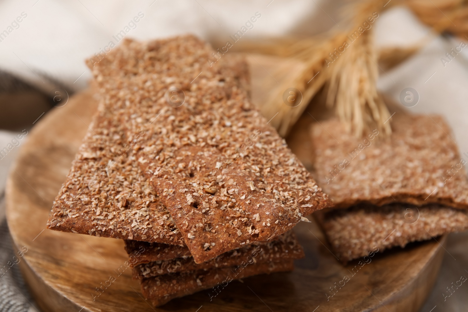 Photo of Stack of dry rye crispbreads on table, closeup