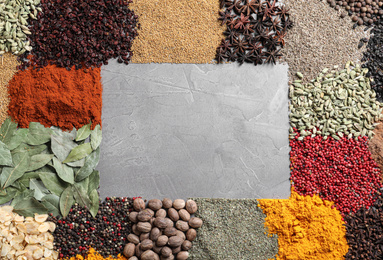 Photo of Frame made with different spices on grey background, flat lay. Space for text