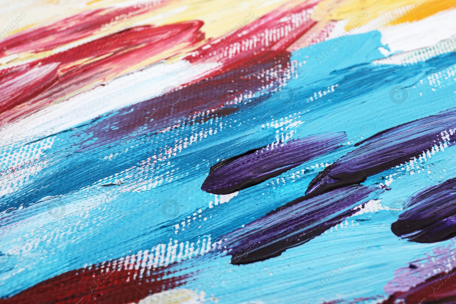 Photo of Beautiful strokes of colorful oil paints on white canvas as background, closeup