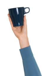 Photo of Woman holding elegant dark blue cup on white background, closeup