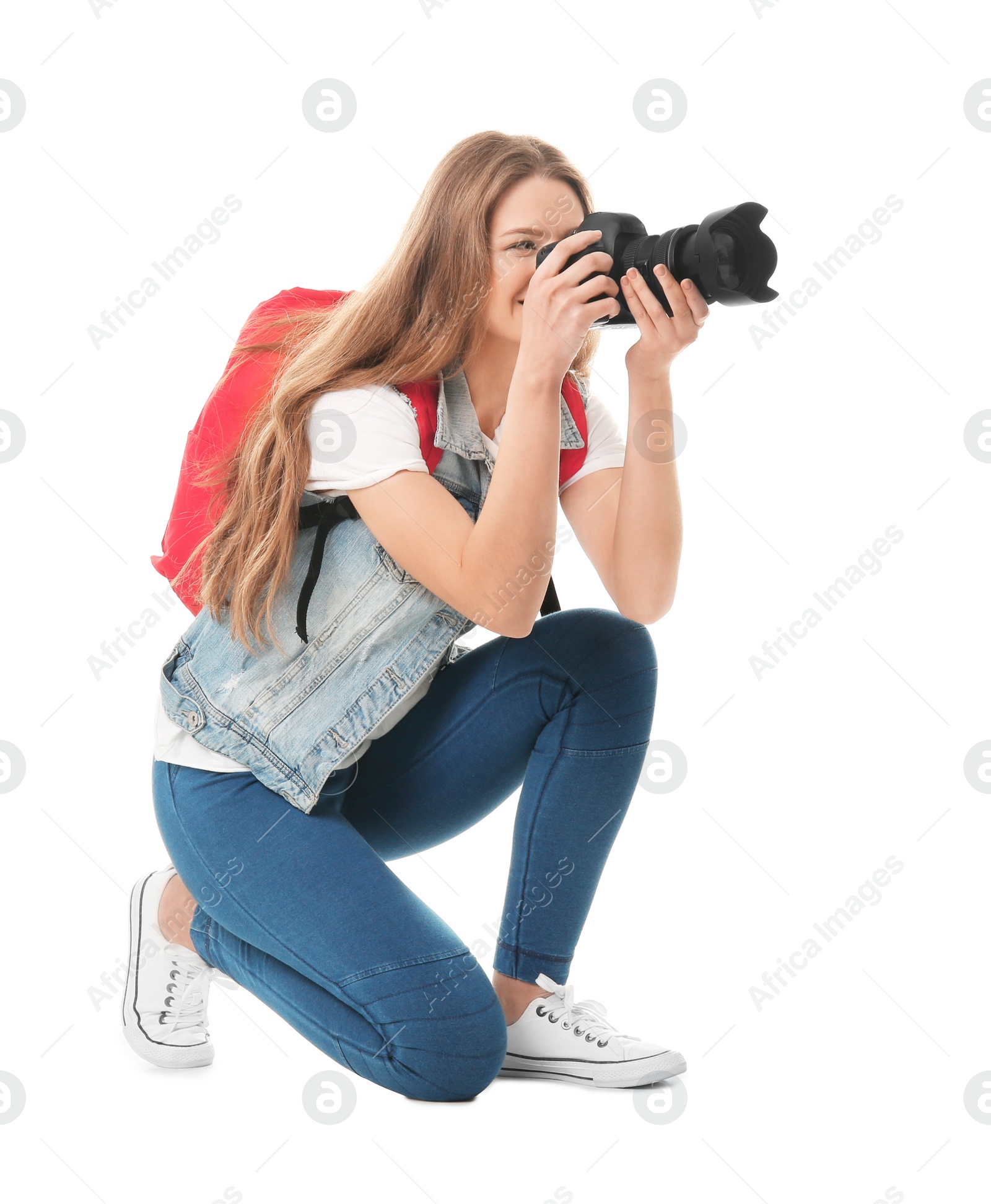 Photo of Female photographer with camera on white background