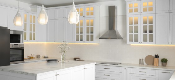 Beautiful kitchen interior with new stylish furniture. Banner design