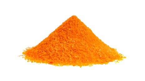 Photo of Heap of orange food coloring isolated on white