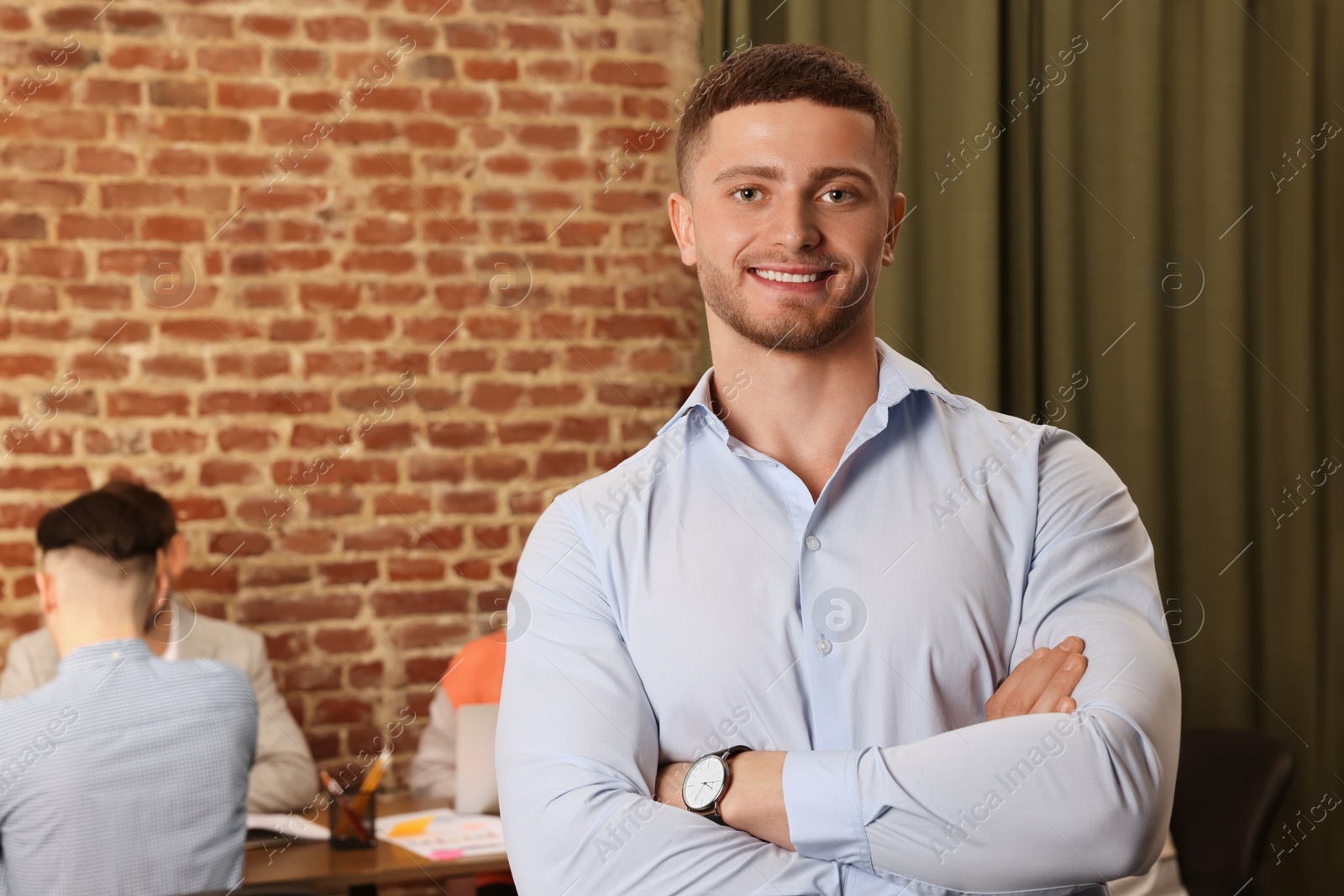 Photo of Portrait of office employee at workplace, space for text