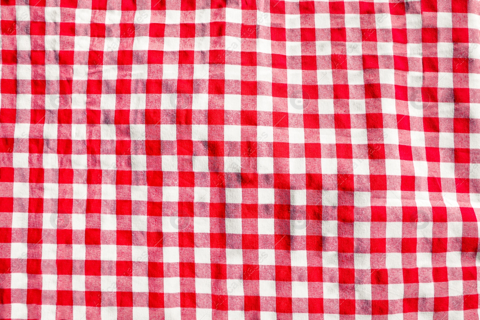 Photo of Red checkered picnic tablecloth as background, top view