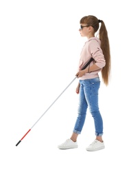 Photo of Blind girl with long cane walking on white background