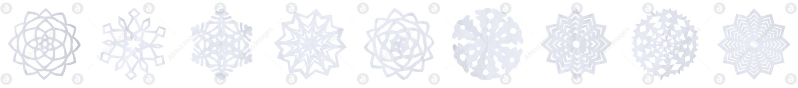 Image of Set of beautiful paper snowflakes on white background. Banner design 