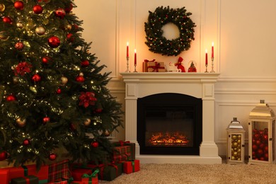 Cozy living room with Christmas tree near fireplace. Interior design