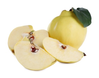 Photo of Ripe fresh quinces with green leaf on white background