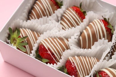 Photo of Box with delicious chocolate covered strawberries on pink background, closeup