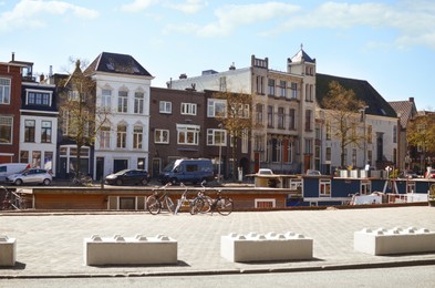 Picturesque view of city street with beautiful buildings and parked bicycles