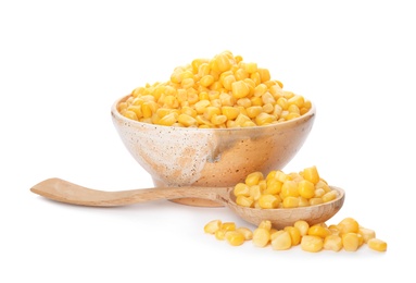 Photo of Bowl and spoon with corn kernels on white background