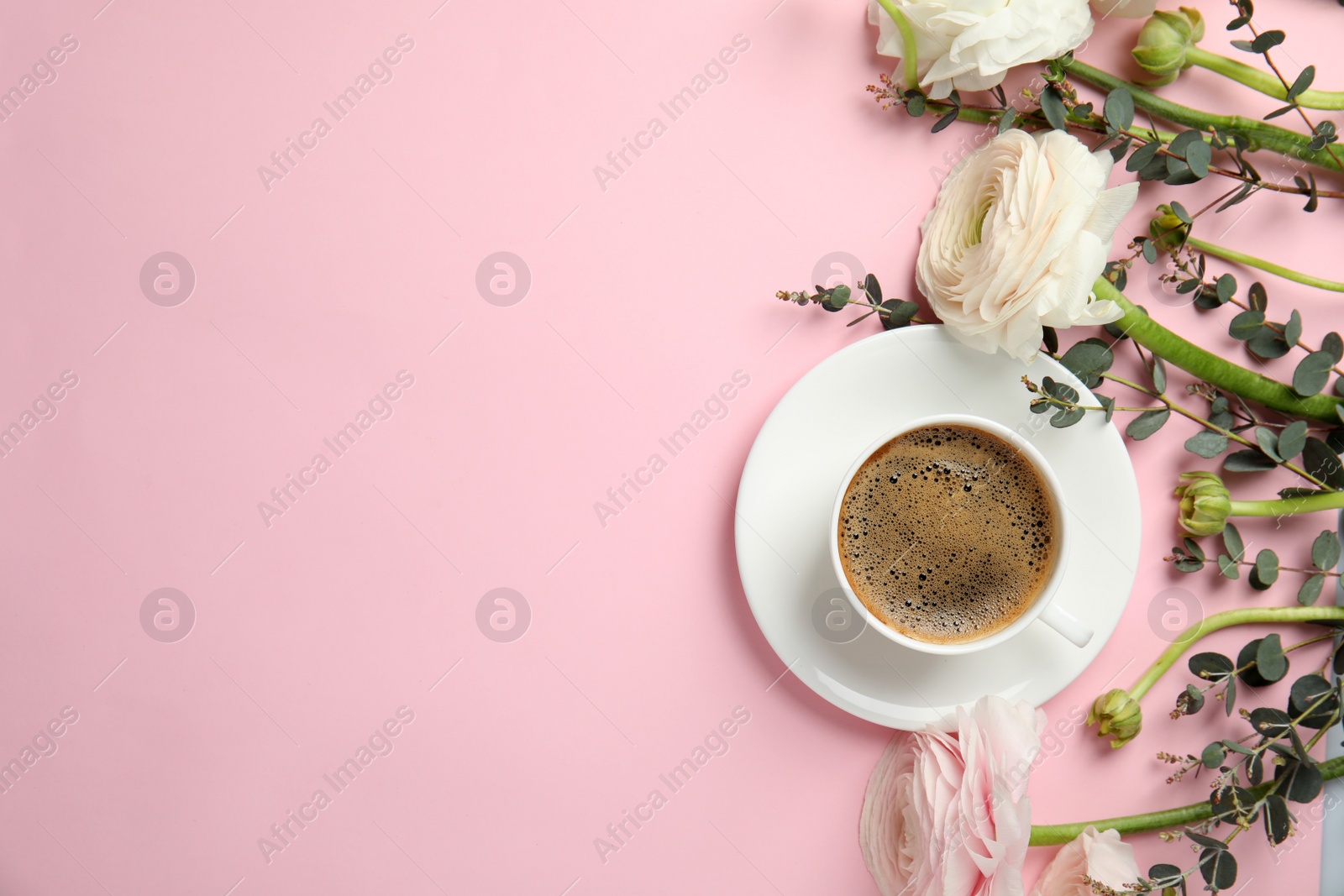 Photo of Flat lay composition with spring ranunculus flowers and cup of coffee on color background. Space for text