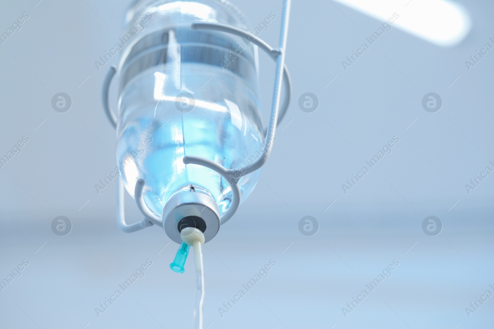 Photo of IV drip in hospital, low angle view. Space for text