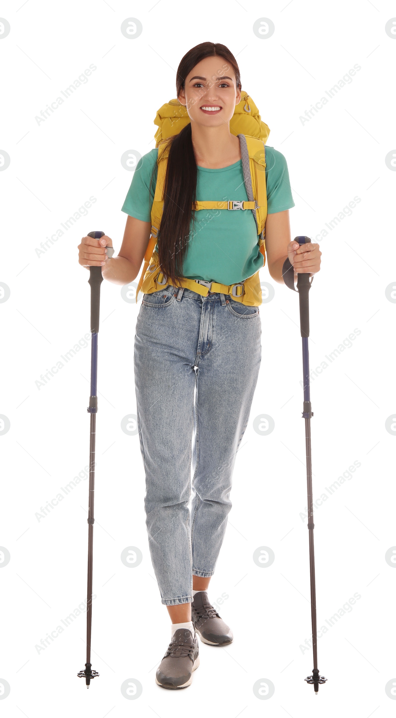 Photo of Female hiker with backpack and trekking poles on white background