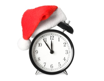 Alarm clock with Santa hat on white background. New Year countdown