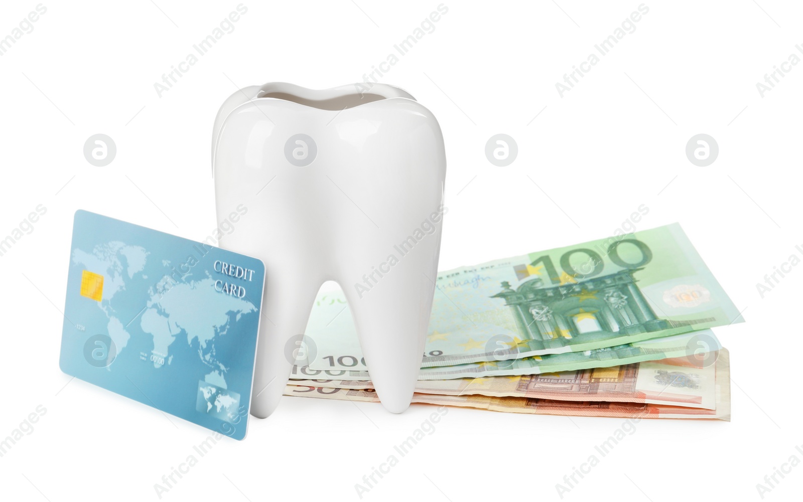 Photo of Ceramic model of tooth, euro banknotes and credit card on white background. Expensive treatment