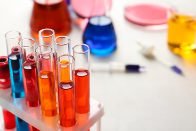 Photo of Test tubes with samples in chemistry laboratory, closeup. Space for text