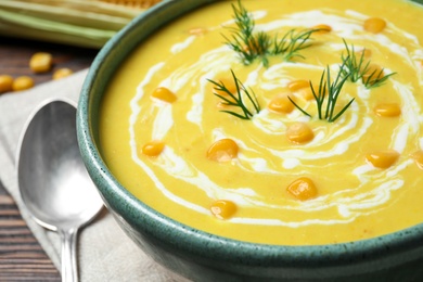 Photo of Delicious creamy corn soup in bowl, closeup