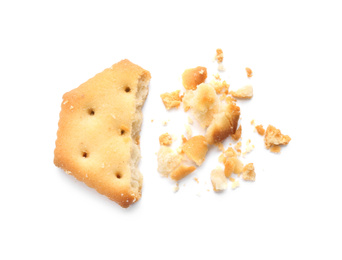 Photo of Broken delicious crispy cracker isolated on white, top view