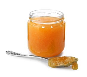 Delicious orange marmalade in jar and spoon on white background