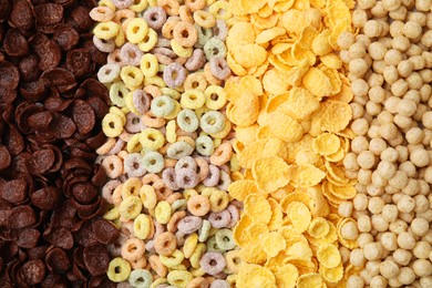 Photo of Different types of breakfast cereals as background, top view