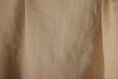 Texture of natural burlap fabric as background, closeup
