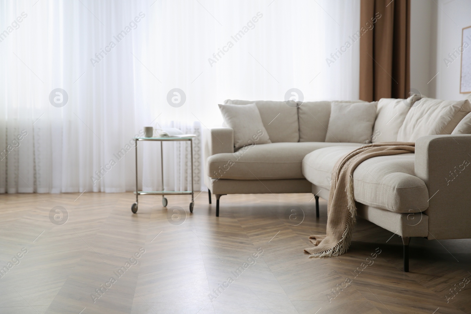 Photo of Modern living room with parquet flooring and stylish furniture