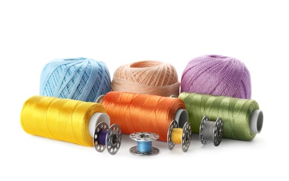 Photo of Color sewing threads on white background