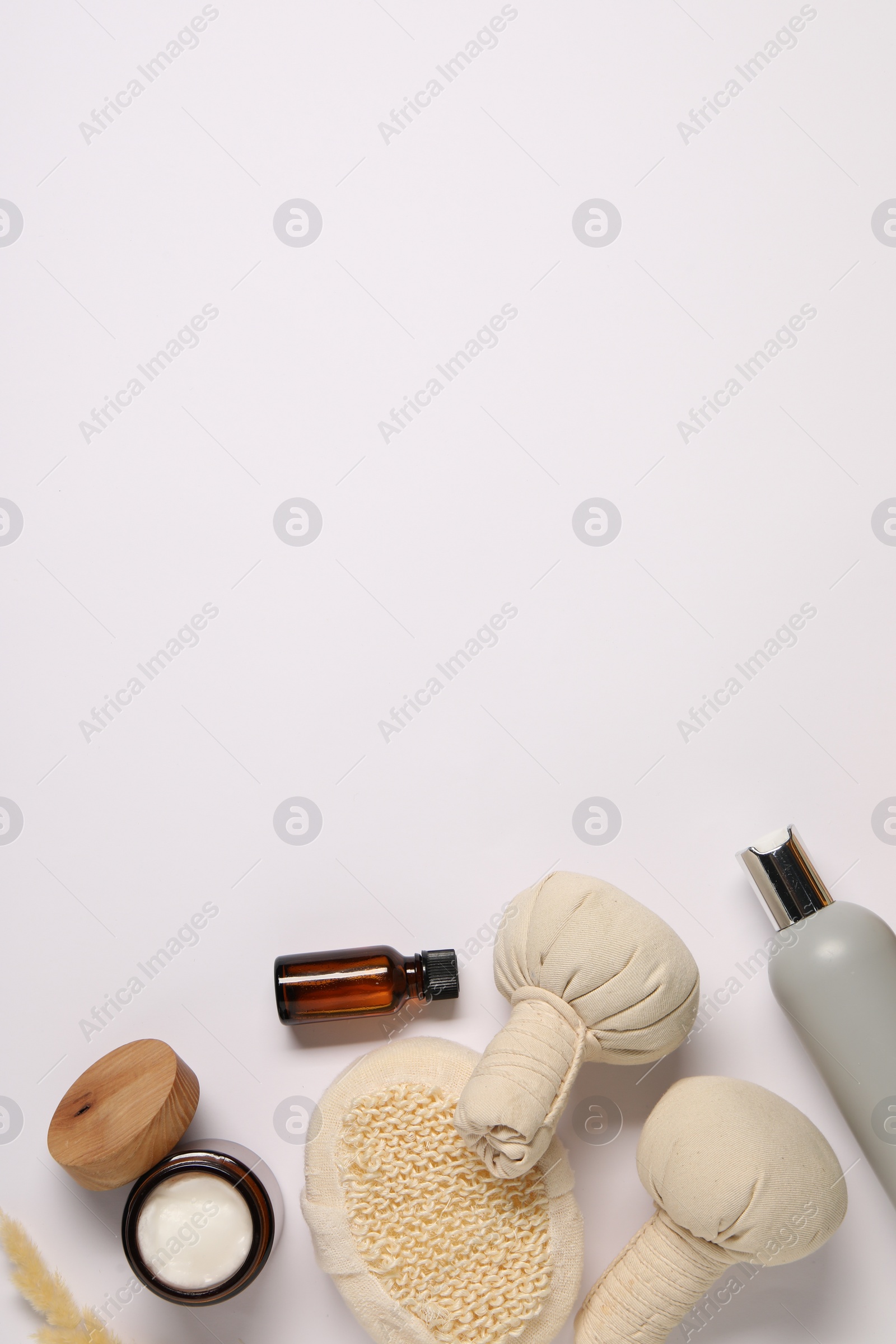 Photo of Bath accessories. Different personal care products and dry spikelet on white background, flat lay with space for text